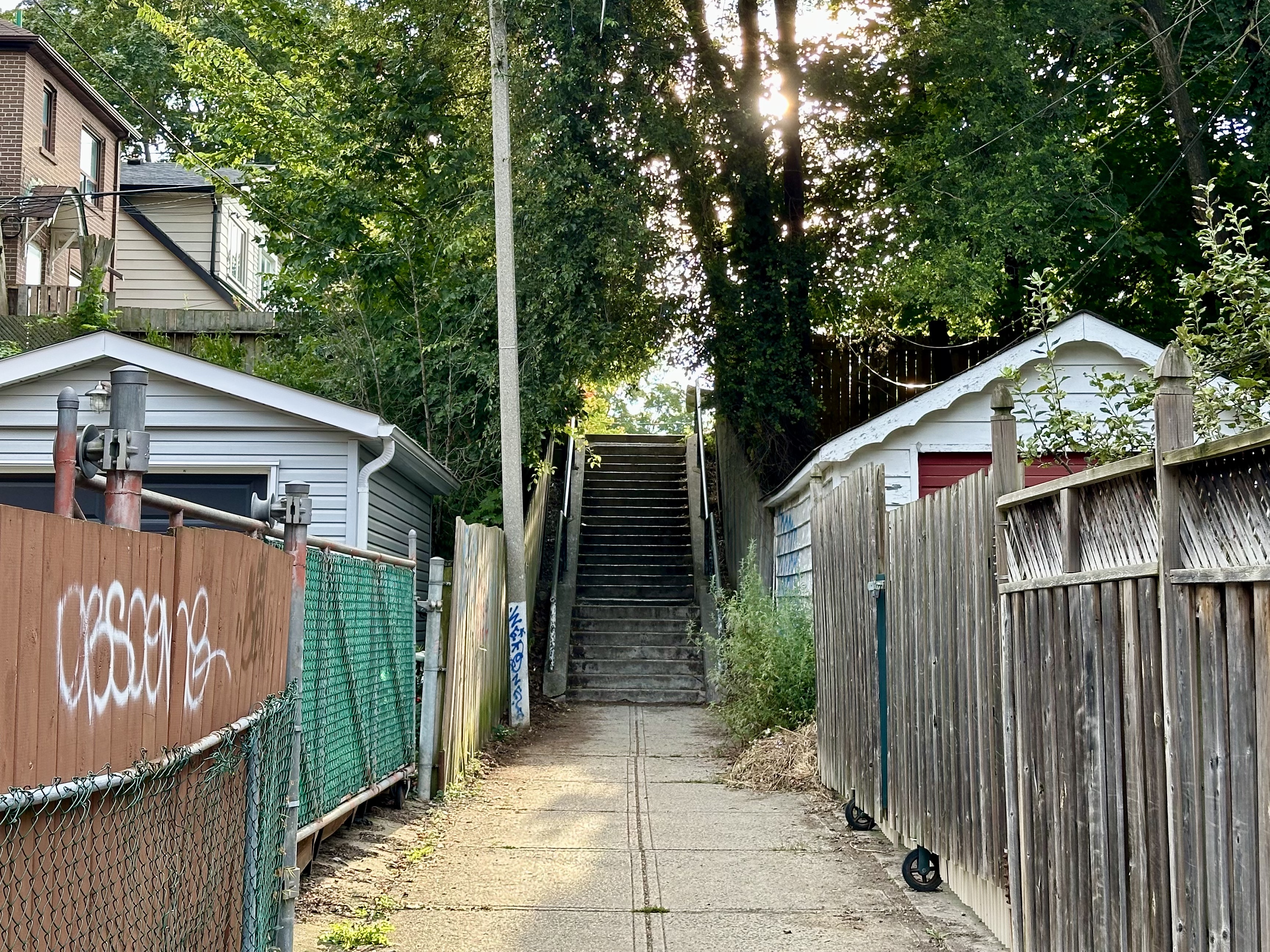 Image of concreate staircase with houses on either side